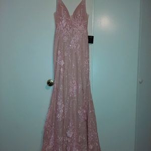 Pink shimmery dress. Size 6 in women's. Never been worn still has tags.